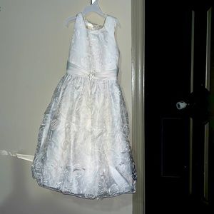 A very pretty white dress and with flower designed all around